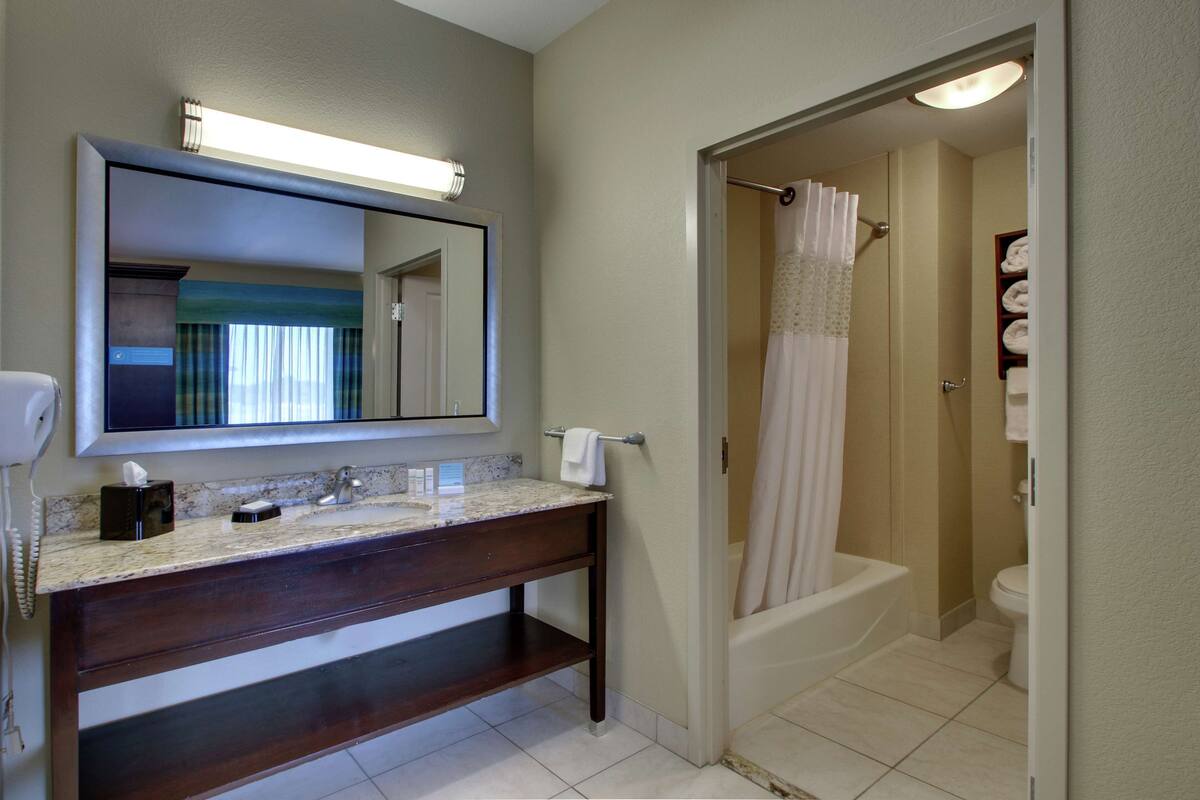 bathtub, jetted bath, hair dryer, towels
