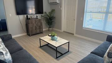 Apartment, 2 Bedrooms | Living area | 32-inch TV with cable channels