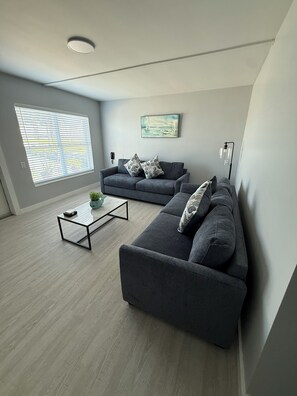 Apartment, 2 Bedrooms | Living room | 32-inch TV with cable channels - Barefoot Bay Resort & Marina (Clearwater Beach)