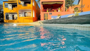 Outdoor pool, open 7:00 AM to 9:00 PM, pool loungers