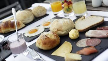 A breakfast buffet with various food items and beverages.