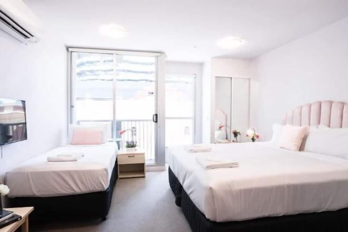 Desk, laptop workspace, blackout curtains, iron/ironing board