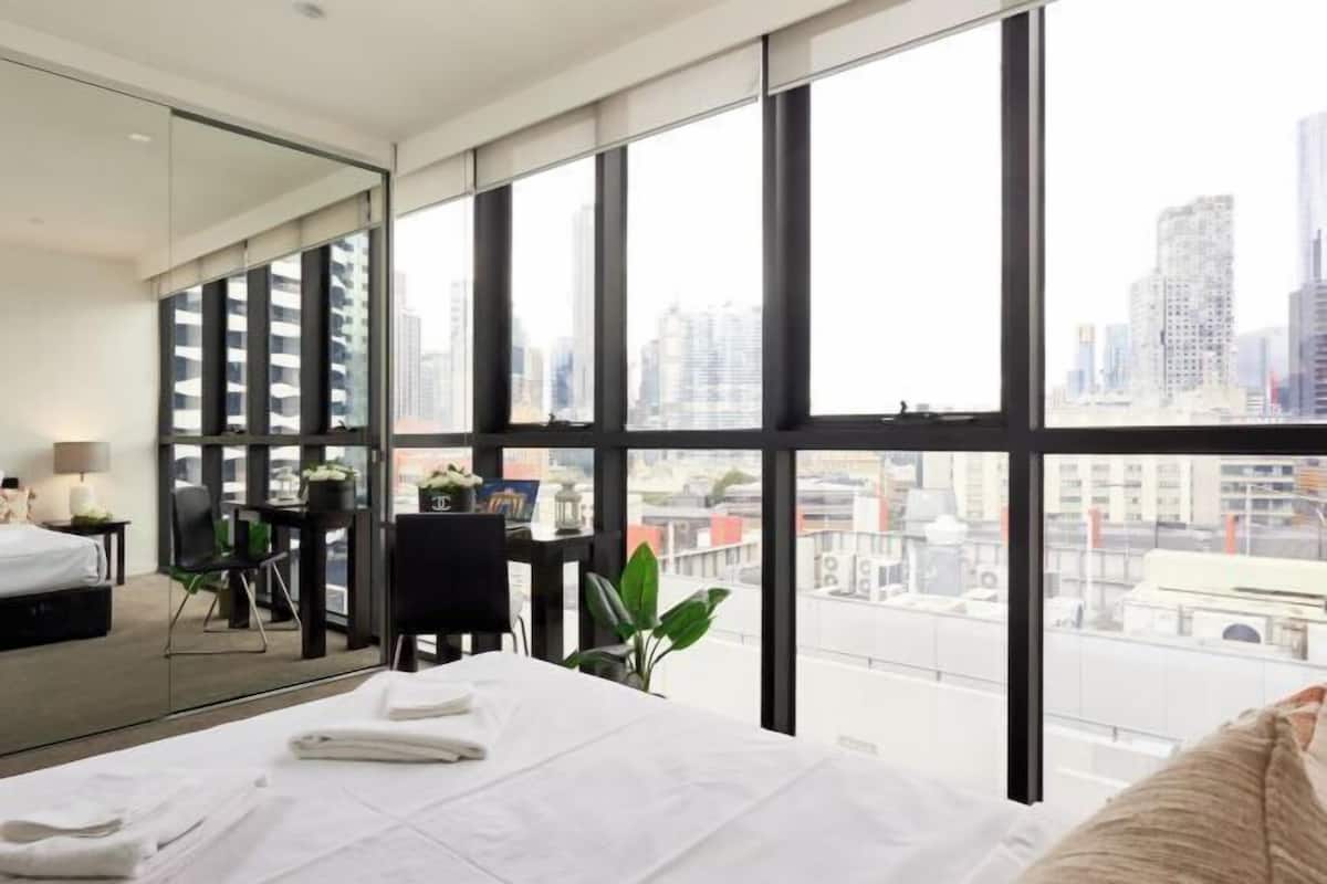 Desk, laptop workspace, blackout curtains, iron/ironing board