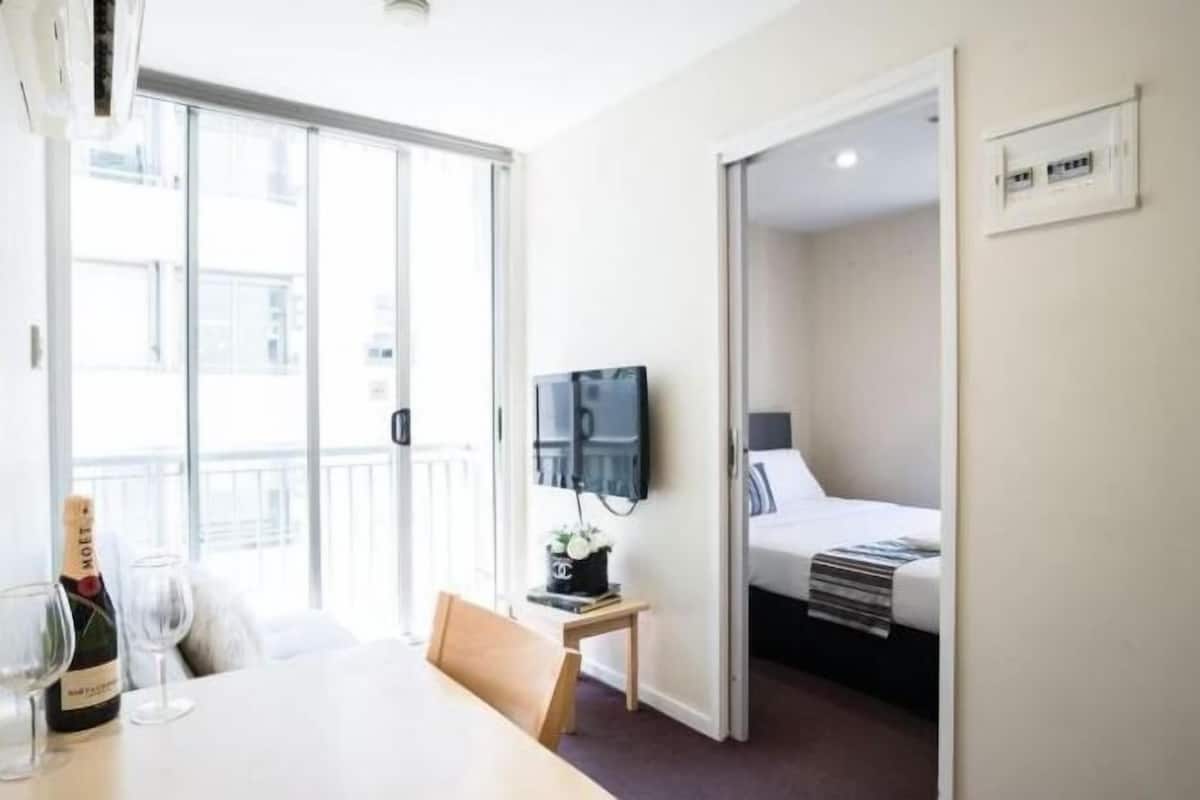 Desk, laptop workspace, blackout curtains, iron/ironing board