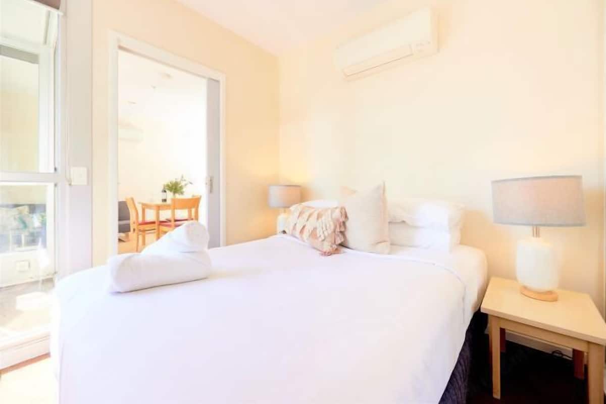 Desk, laptop workspace, blackout curtains, iron/ironing board