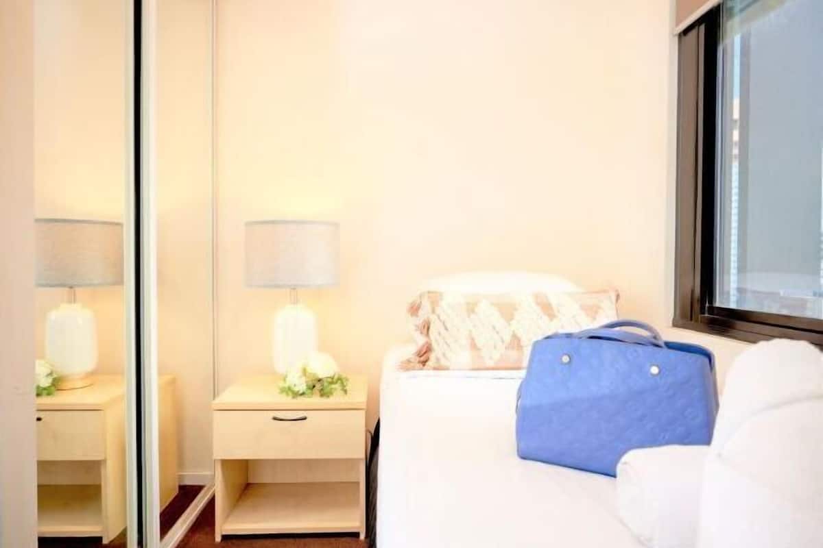 Desk, laptop workspace, blackout curtains, iron/ironing board