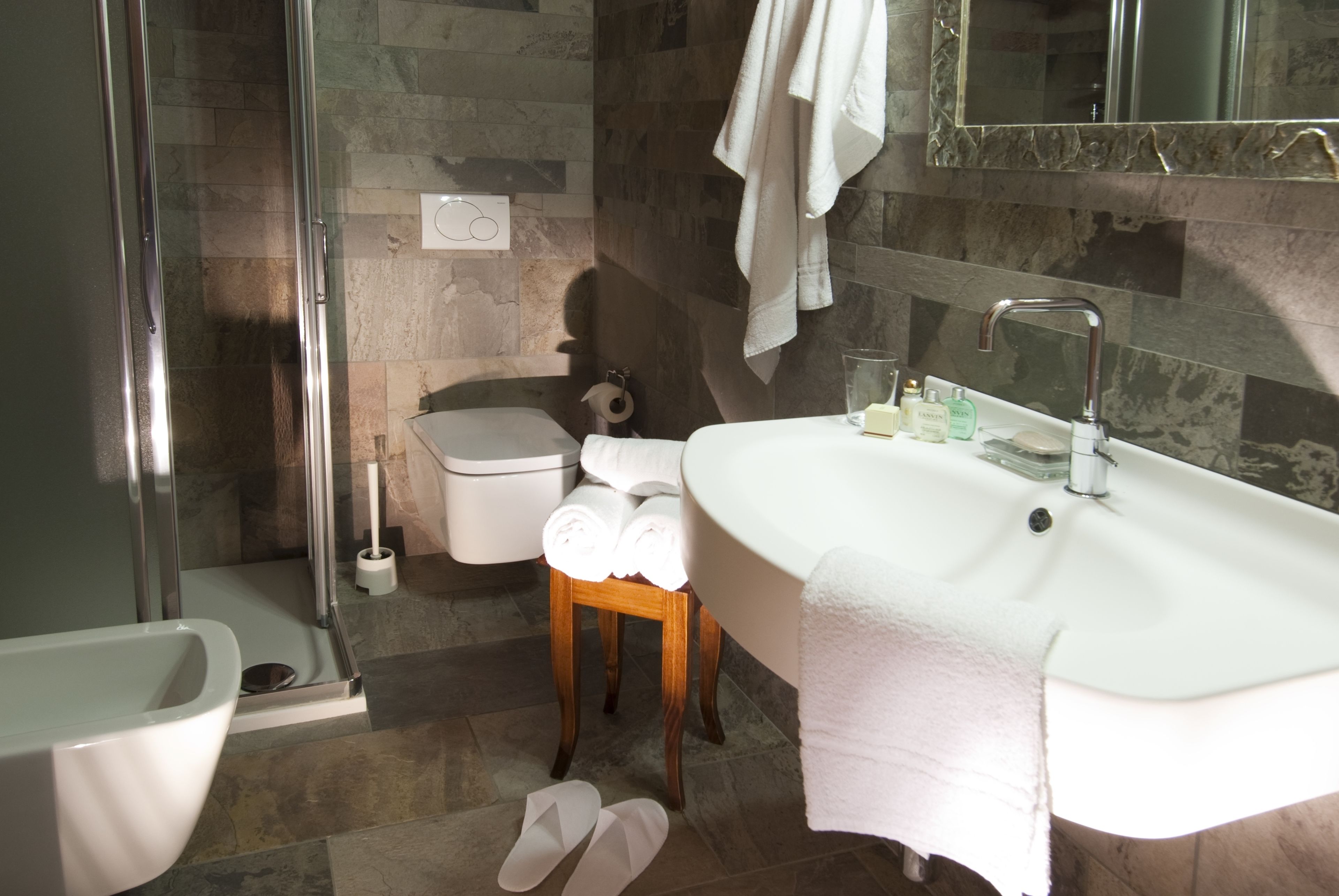 Shower, designer toiletries, hair dryer, bathrobes