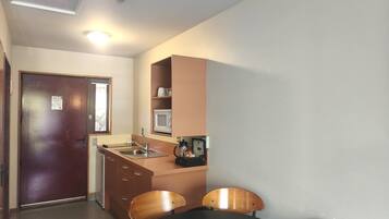 Family Apartment, 2 Bedrooms | Private kitchen | Fridge, microwave, stovetop, coffee/tea maker