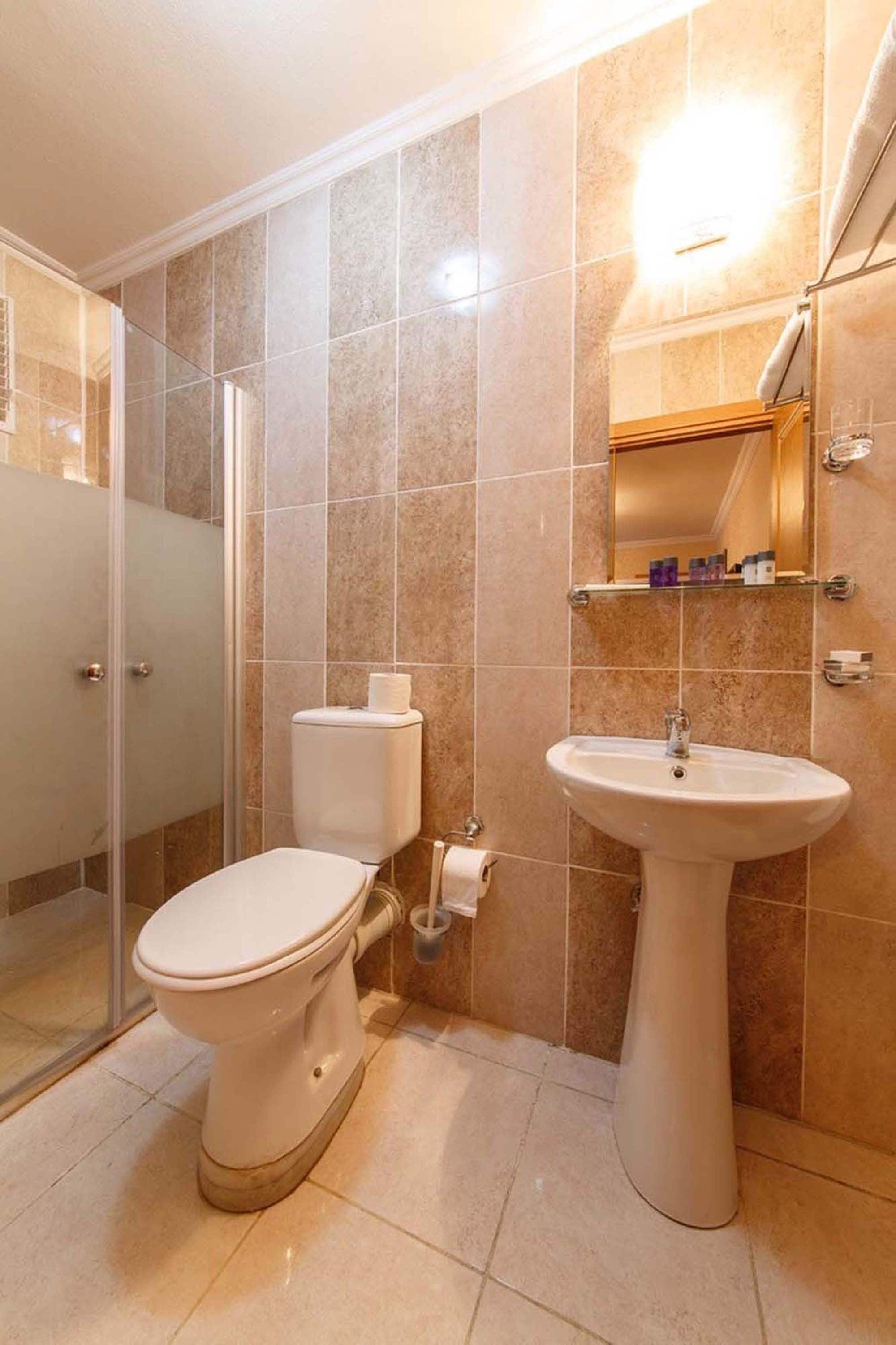 shower, free toiletries, hair dryer, slippers