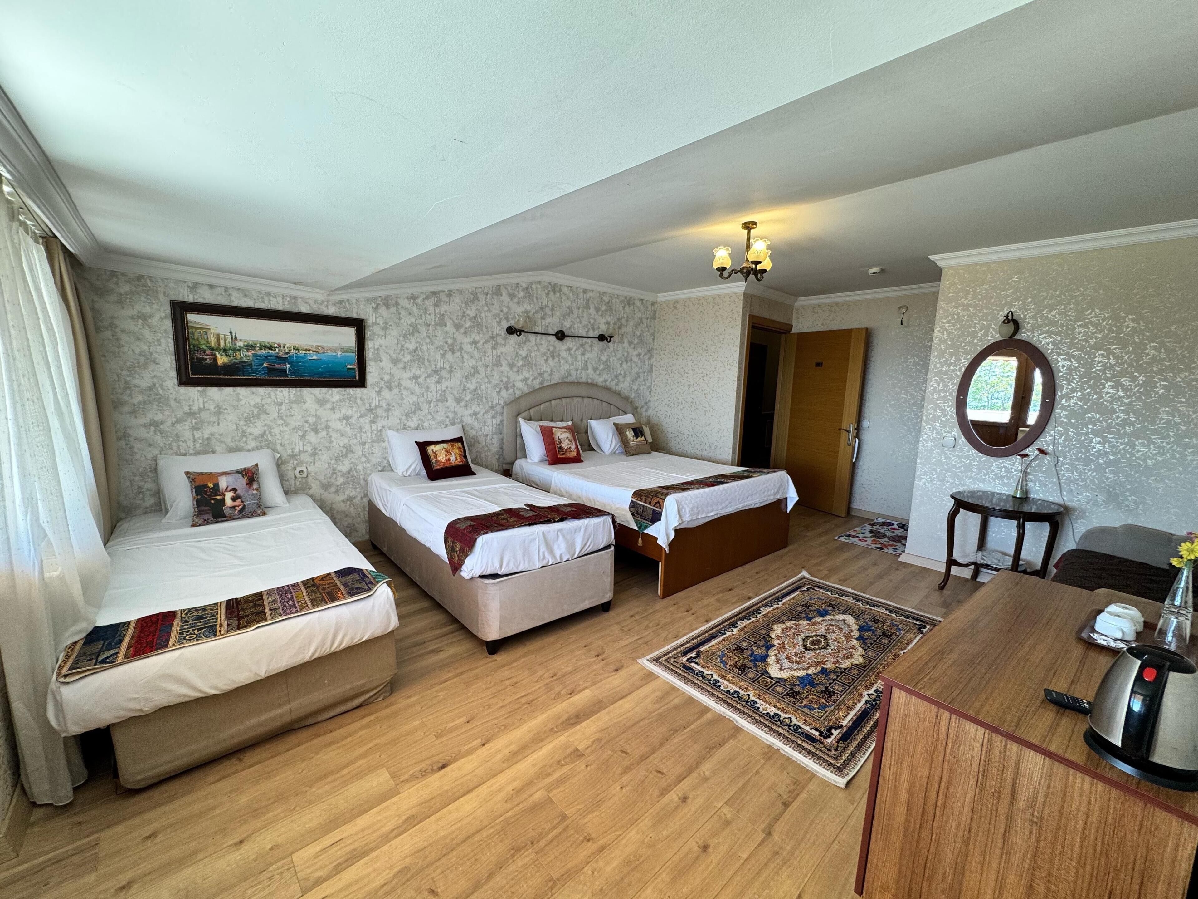 quadruple room with sea view | 1 bedroom, minibar, in-room safe, desk