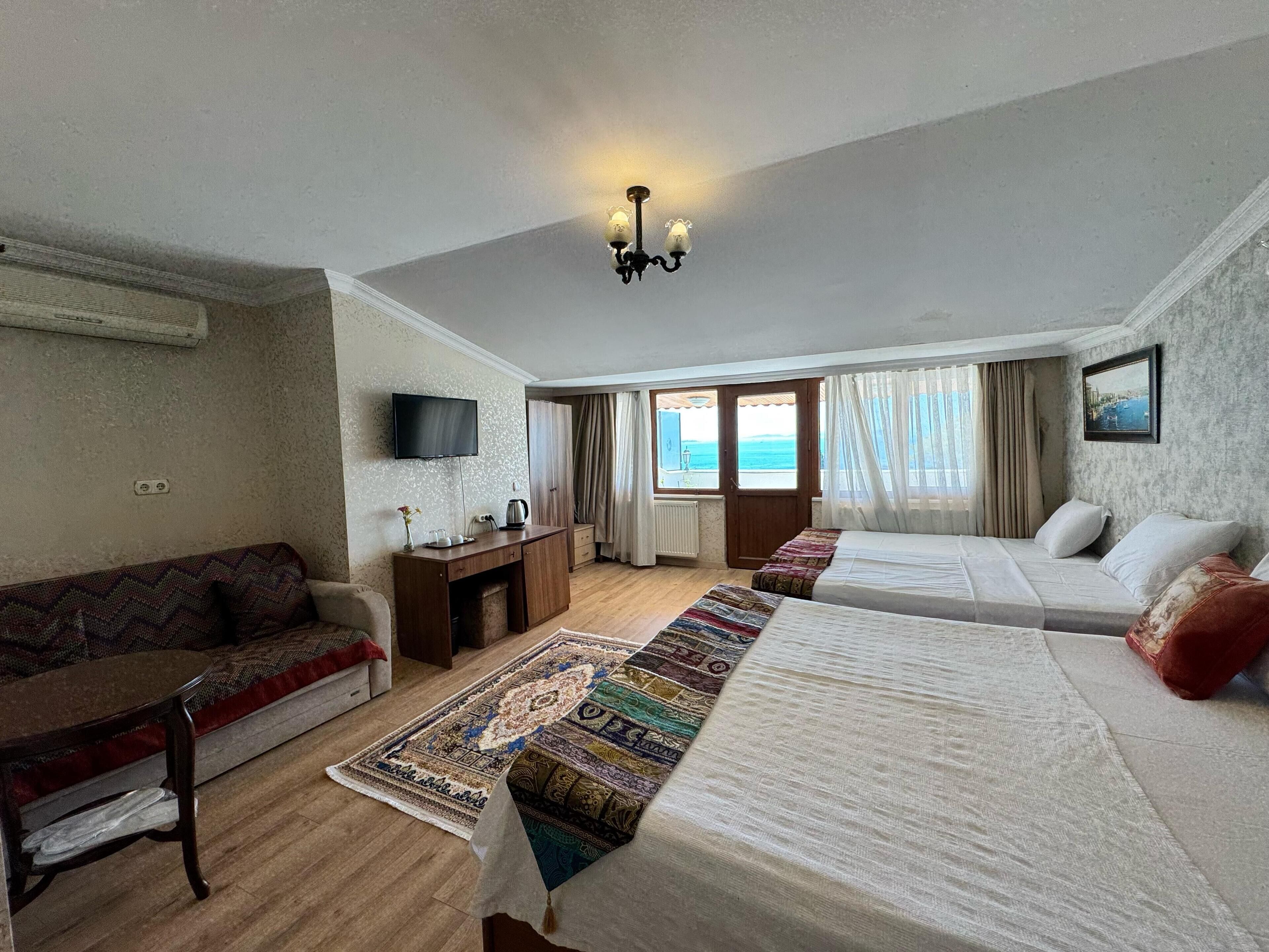 quadruple room with sea view | 1 bedroom, minibar, in-room safe, desk