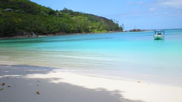 Beach nearby, white sand, beach towels