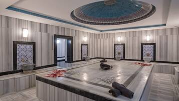 Experience the grandeur of this elegant space, featuring a high ceiling, ornate mirror, and stylish furnishings.