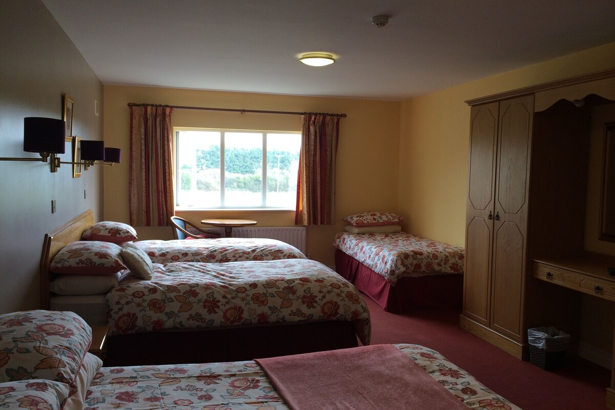 Desk, laptop workspace, iron/ironing board, free cots/infant beds