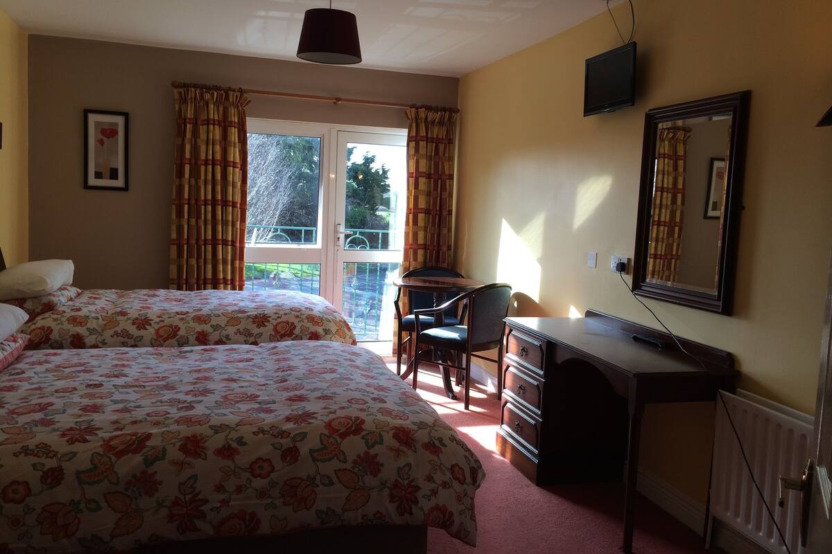 Desk, laptop workspace, iron/ironing board, free cots/infant beds