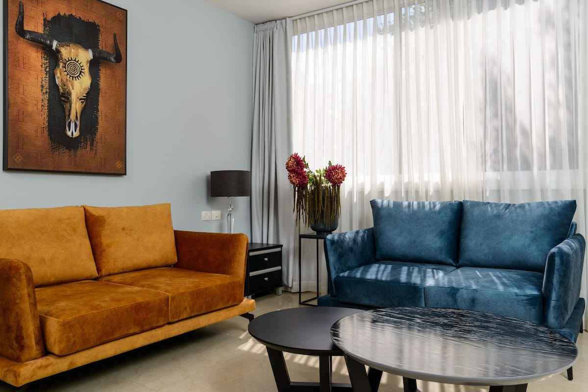 Standard Apartment, 2 Bedrooms | Living area | 32-inch flat-screen TV with cable channels, TV
