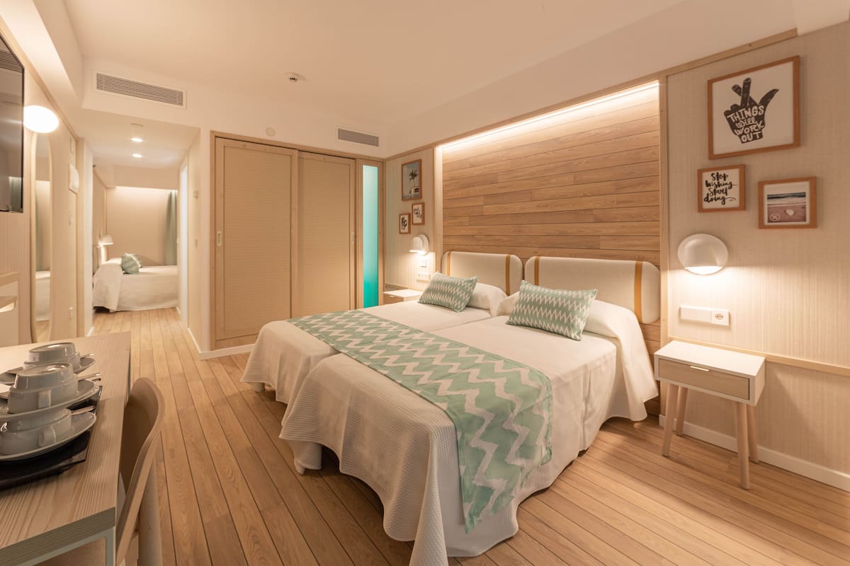 family room, pool view | 1 bedroom, desk, blackout curtains, soundproofing