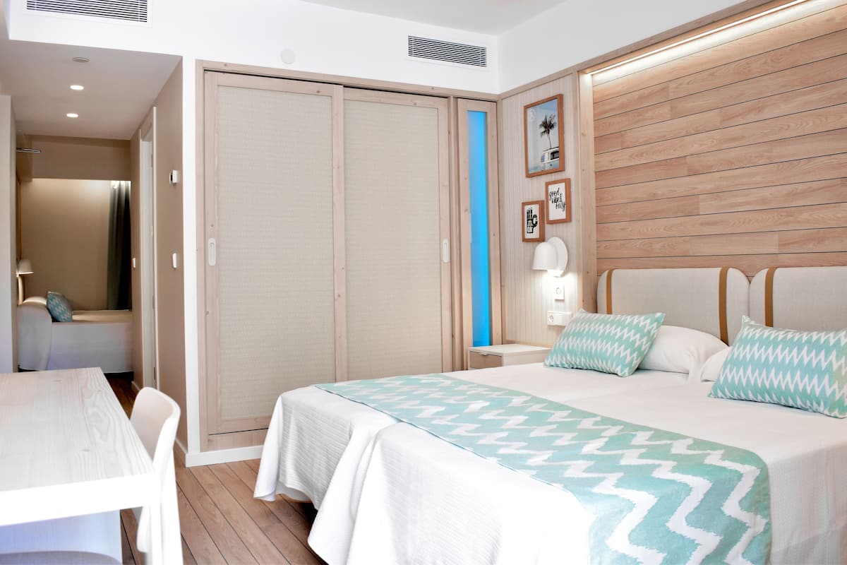 family room, pool view | 1 bedroom, desk, blackout curtains, soundproofing