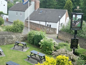 A pub named Nelson & Railway with outdoor seating and a beer garden.