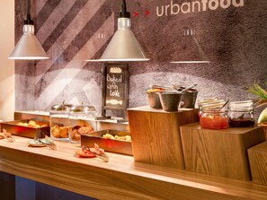 A breakfast buffet with various food items, utensils, and a chalkboard sign saying "Baked with Love". - ibis Kyiv City Center (Kyiv)