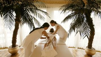 Relax in a serene space surrounded by lush palm trees and ornate details.