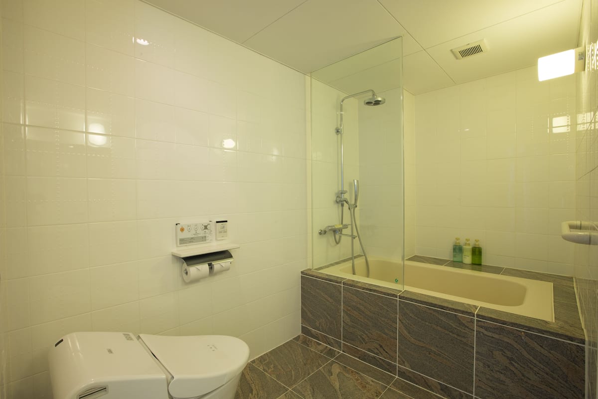 deluxe room with tatami area and ocean view | 1 bedroom, in-room safe, blackout curtains, iron/ironing board