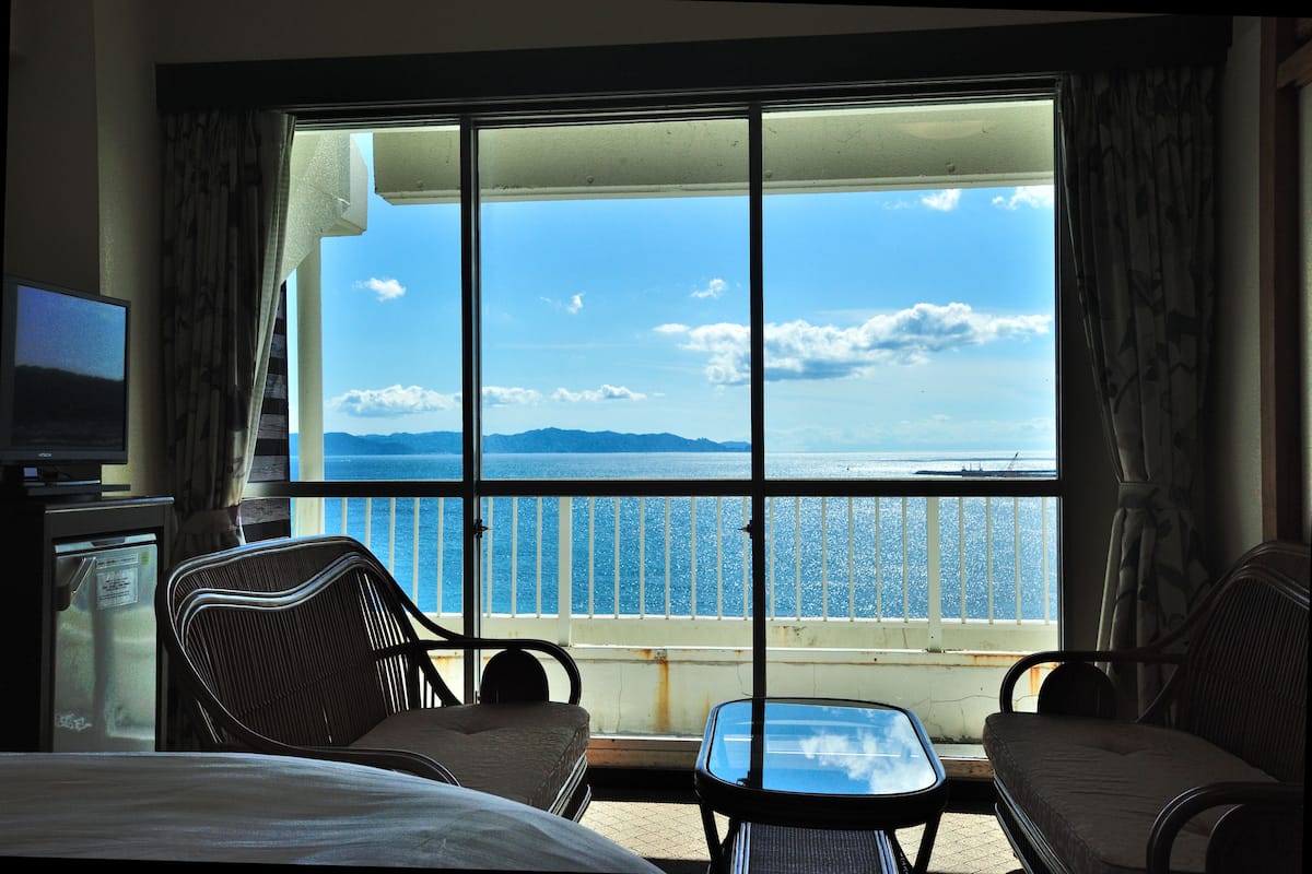 deluxe room with tatami area and ocean view | 1 bedroom, in-room safe, blackout curtains, iron/ironing board