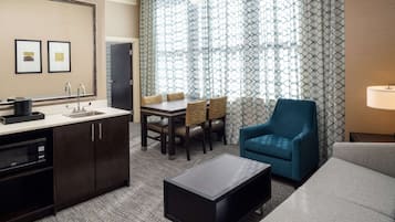 Suite, 1 King Bed with Sofa bed, Refrigerator & Microwave | Living area | 50-inch flat-screen TV with cable channels, TV, Netflix