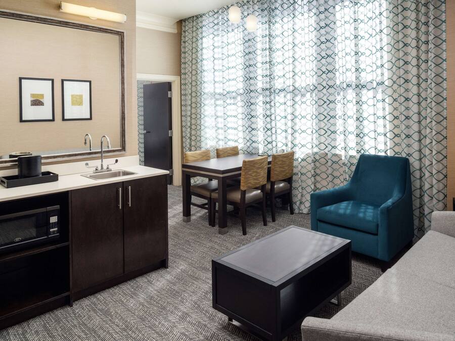 Suite, 1 King Bed with Sofa bed, Refrigerator & Microwave | Living area | 50-inch flat-screen TV with cable channels, TV, Netflix