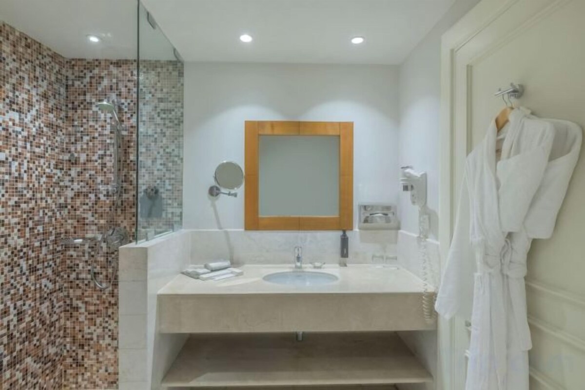 Bathroom | Shower, rainfall showerhead, eco-friendly toiletries, hair dryer