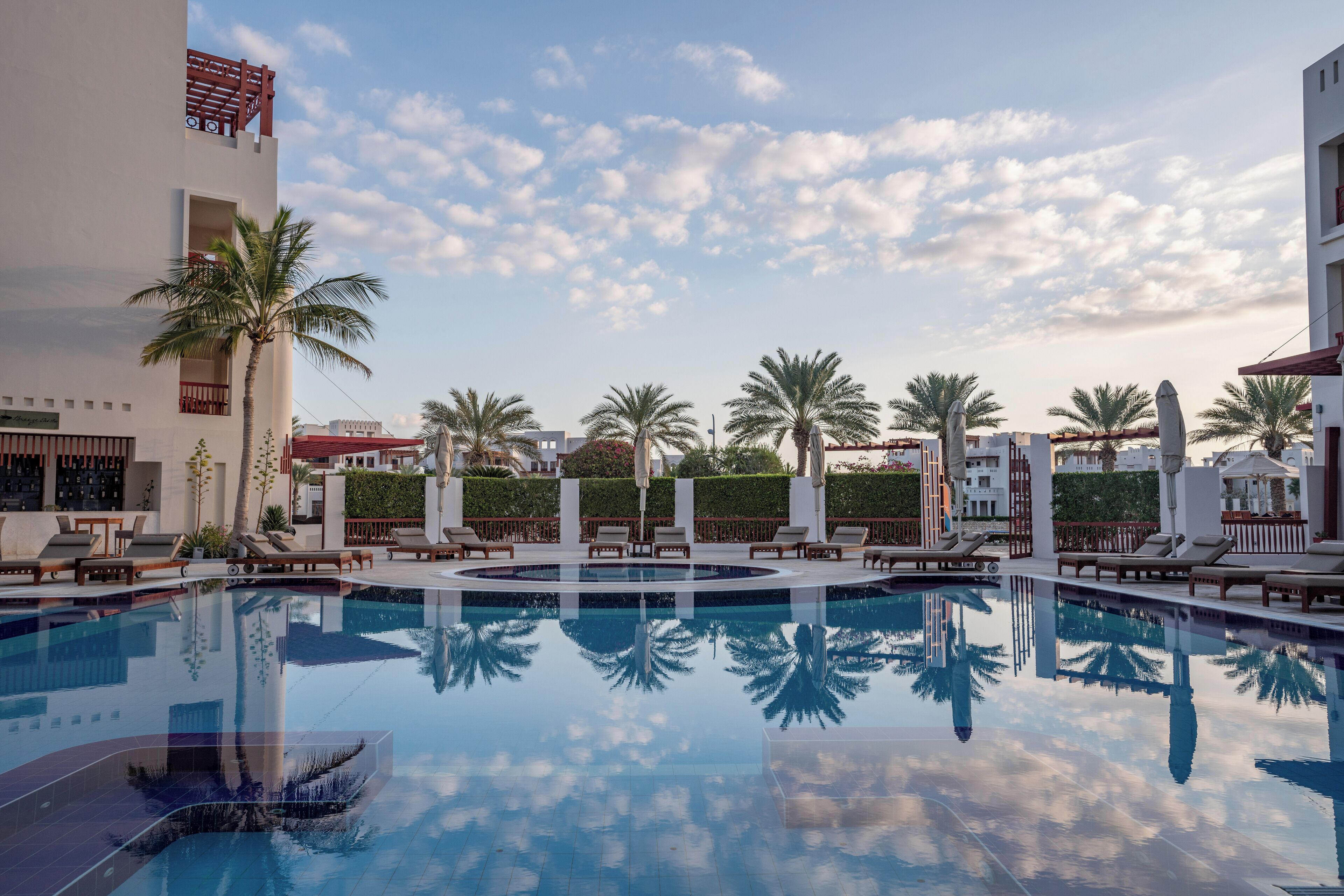 outdoor pool, pool umbrellas, pool loungers