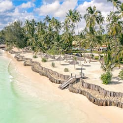 On the beach, white sand, sun-loungers, beach umbrellas