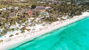 On the beach, sun-loungers, beach umbrellas, beach towels