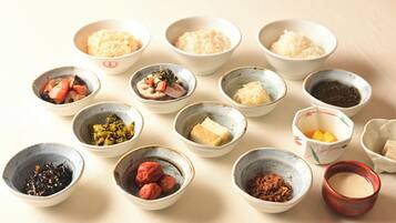 A variety of small bowls containing different food items, likely part of a Japanese meal.