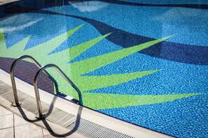 3 outdoor pools, open 7 AM to 7:00 PM, pool umbrellas