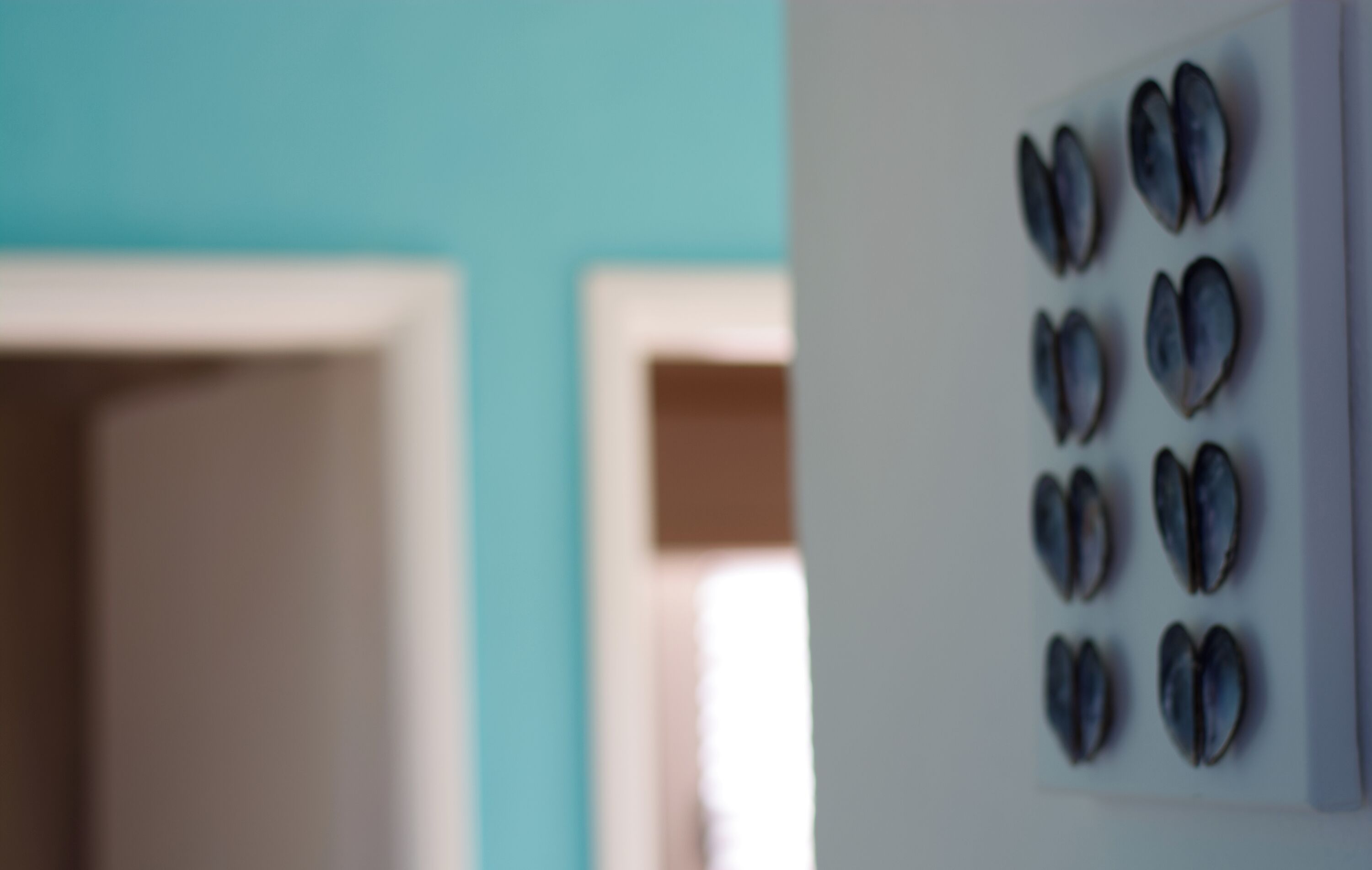 A wall with a series of circular objects arranged in a grid pattern.