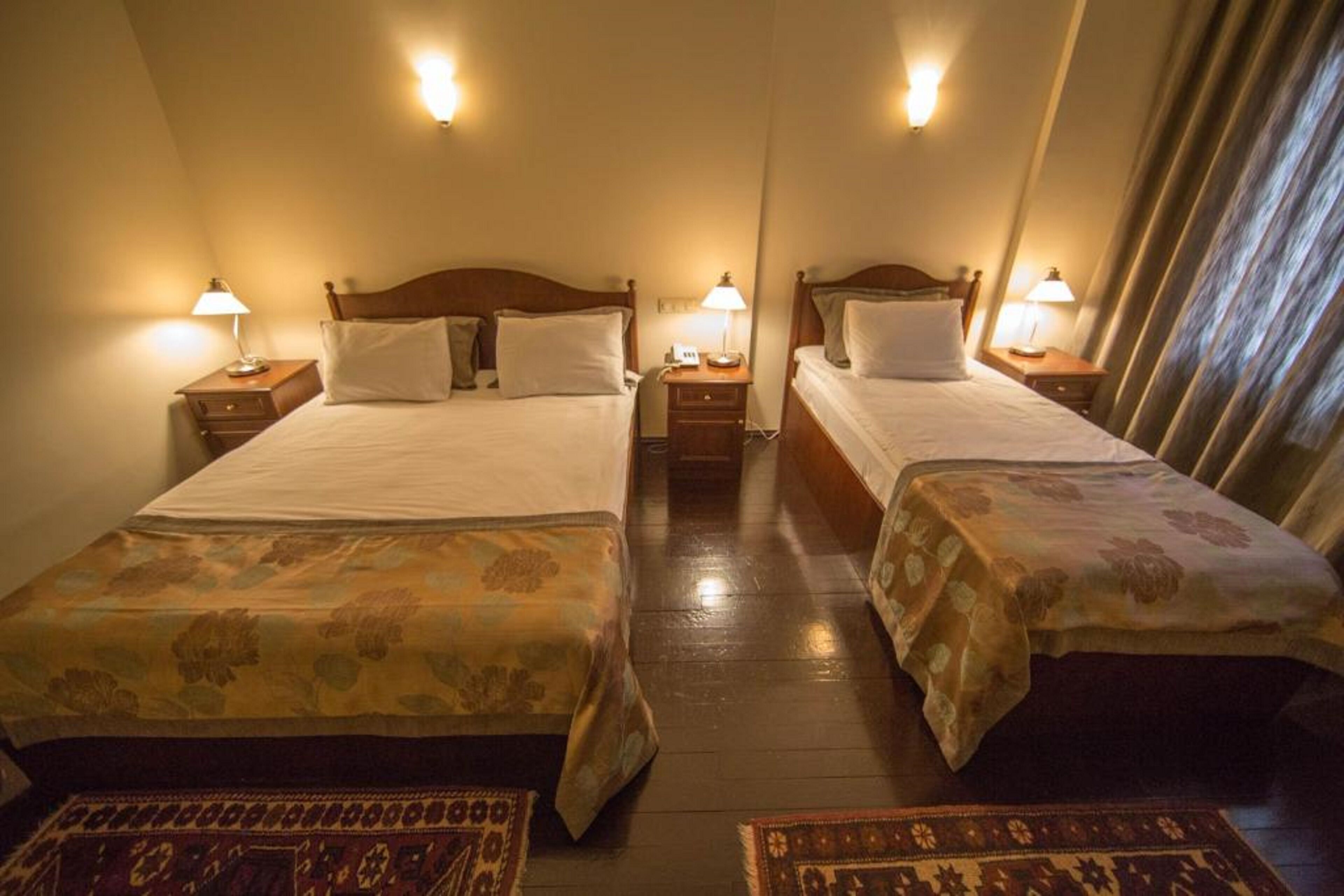 deluxe triple room | minibar, laptop workspace, iron/ironing board, free wifi