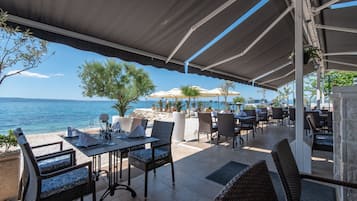 Breakfast, lunch, dinner served; beach views