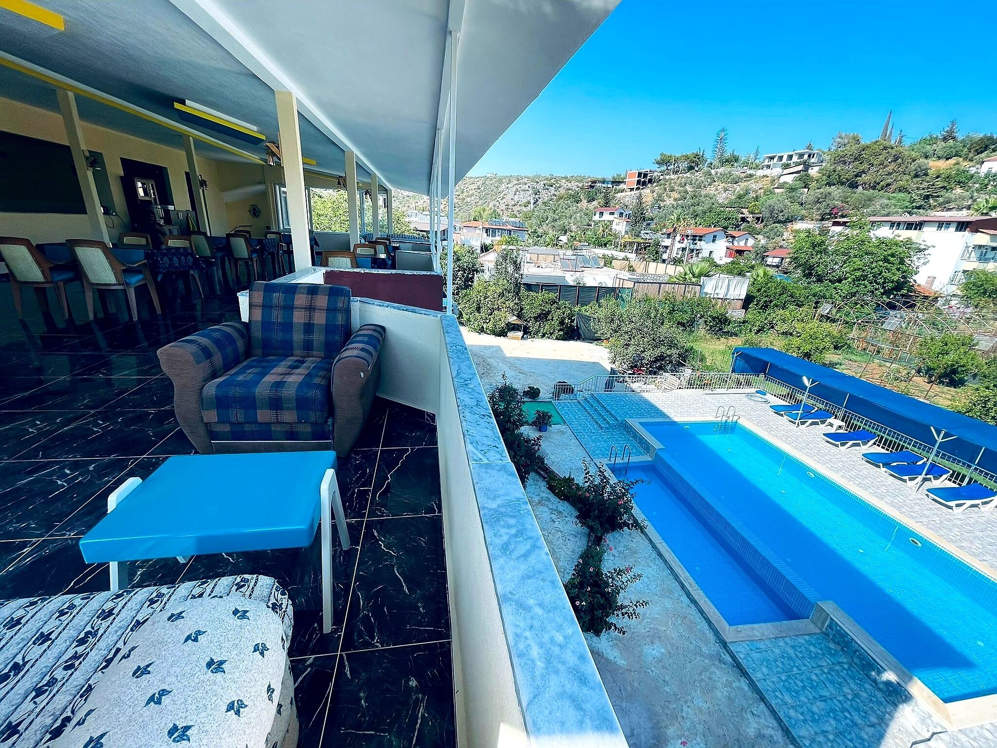 Seasonal outdoor pool, pool umbrellas, pool loungers