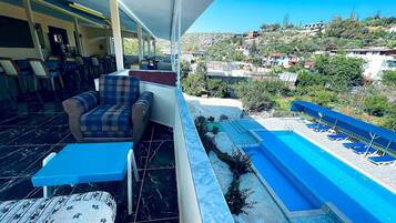 Seasonal outdoor pool, pool umbrellas, pool loungers