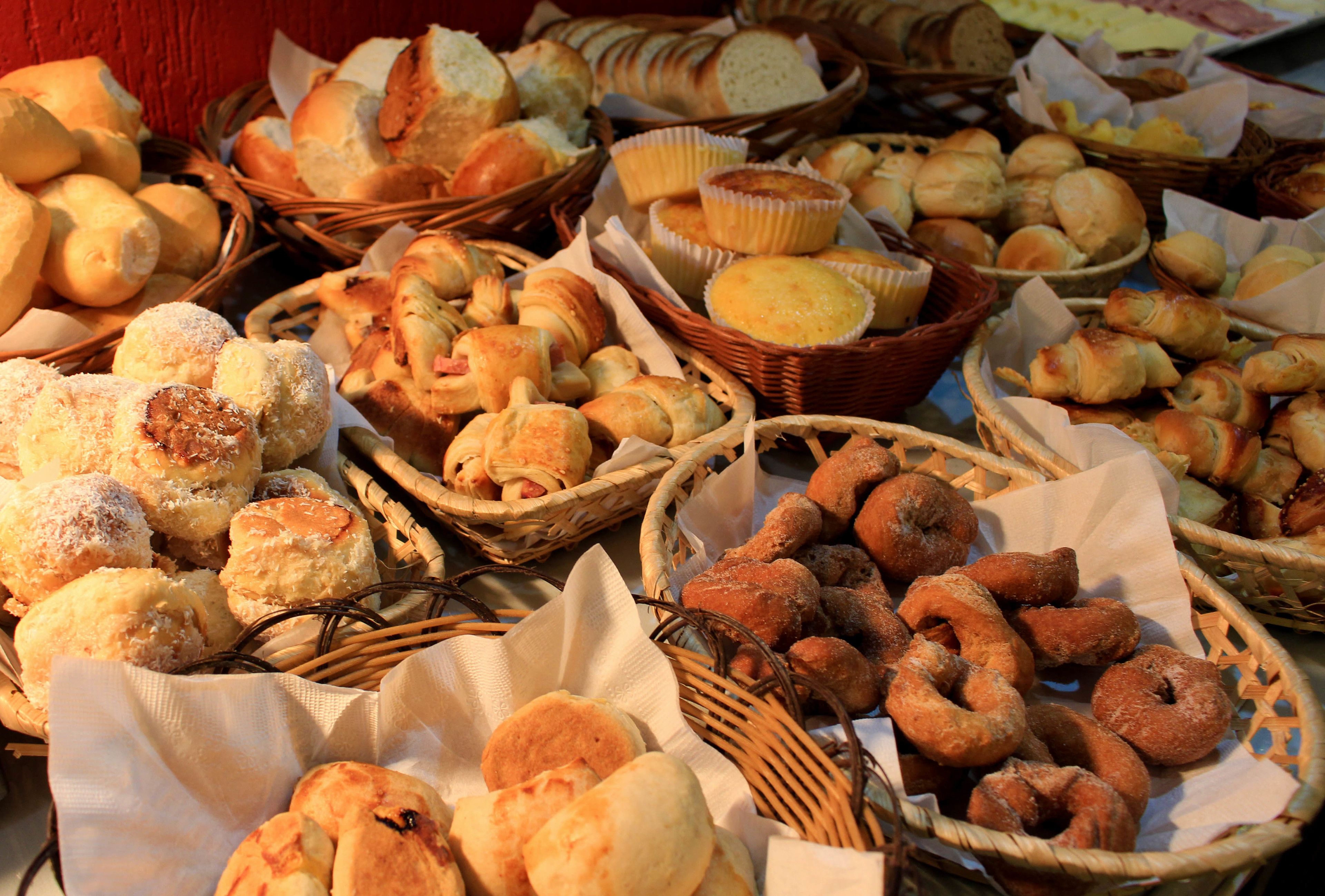 A variety of baked goods displayed in baskets.