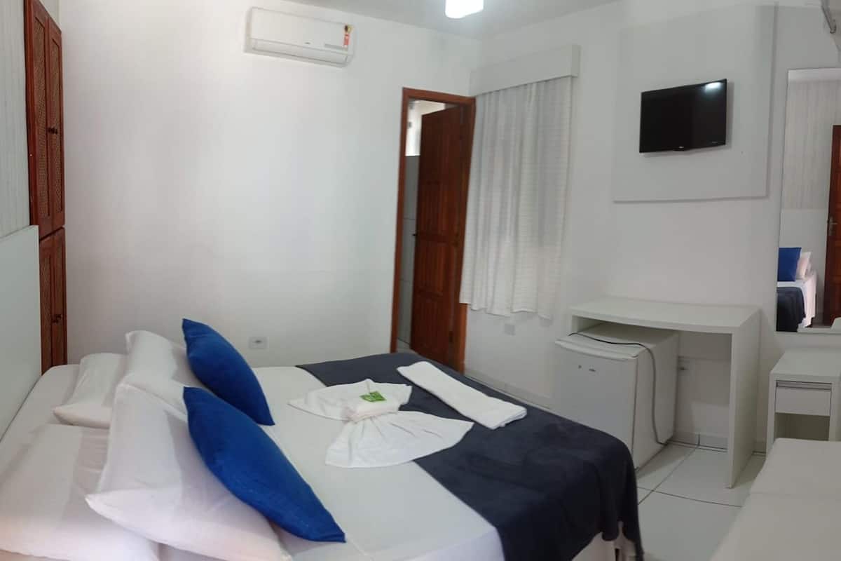 Economy kamer, 1 twee- of 2 eenpersoonsbedden | 1 slaapkamer, een minibar, gratis wifi, beddengoed