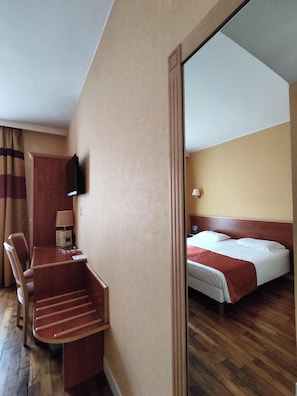 Premium bedding, desk, laptop workspace, blackout curtains