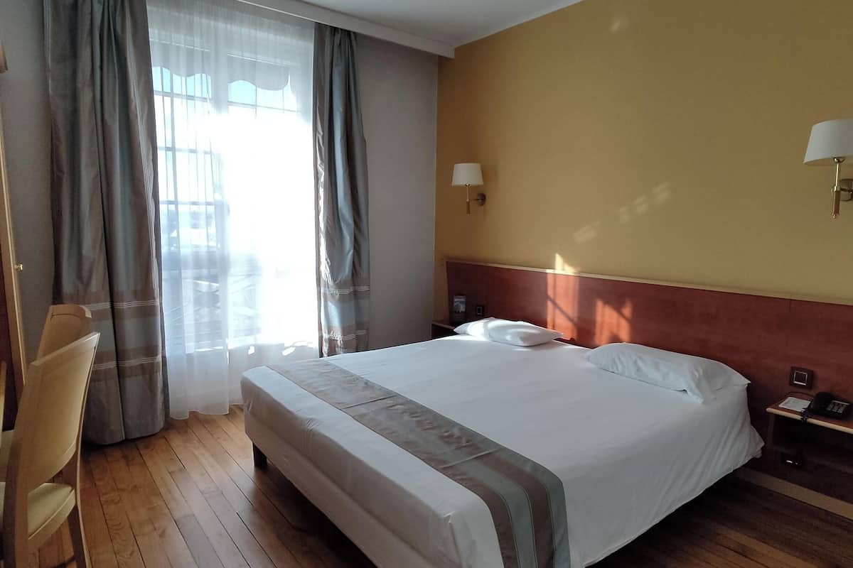 premium bedding, desk, laptop workspace, blackout curtains