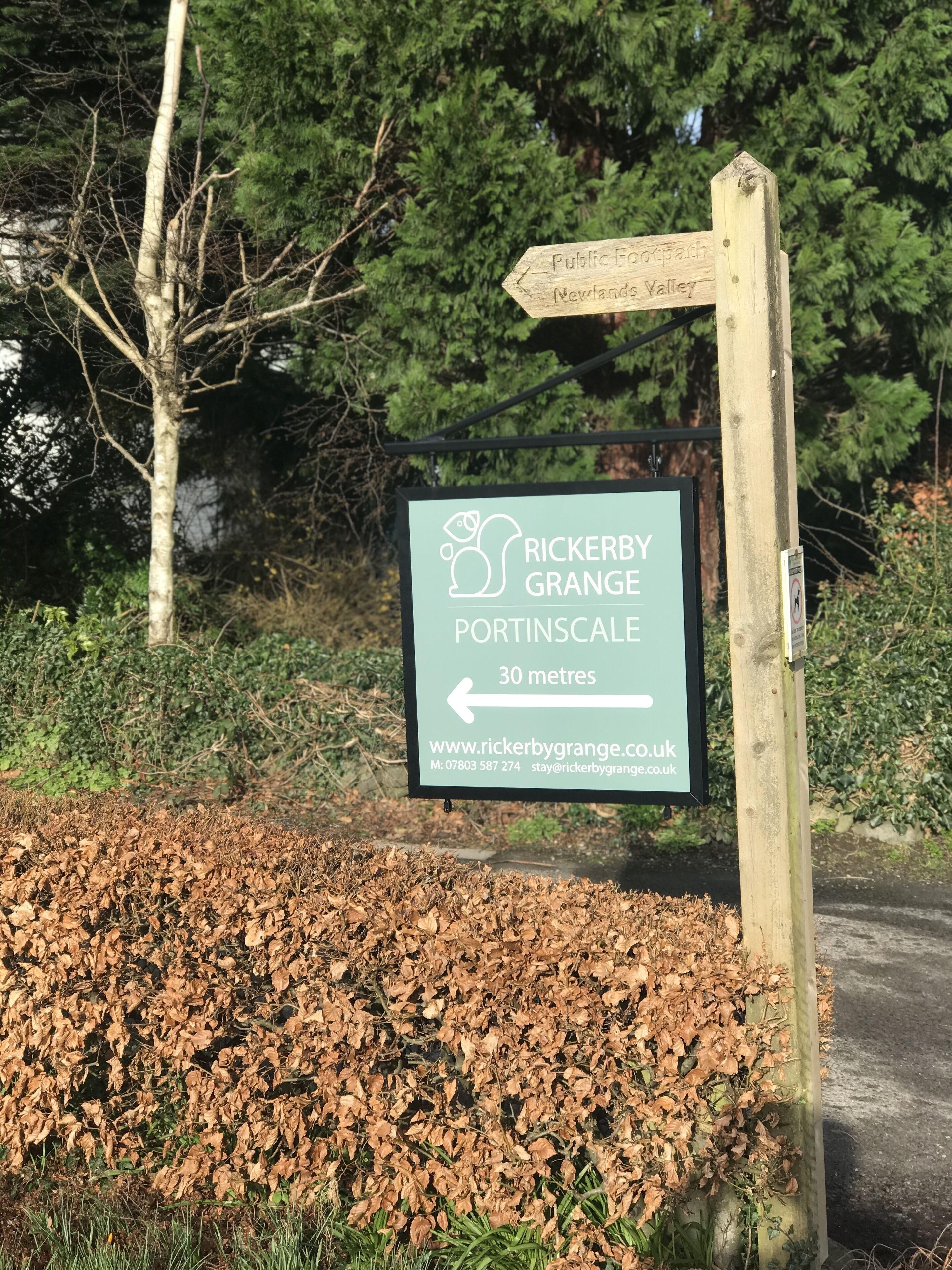 A sign for Rickeby Grange Portinscale, indicating a 30-metre distance.