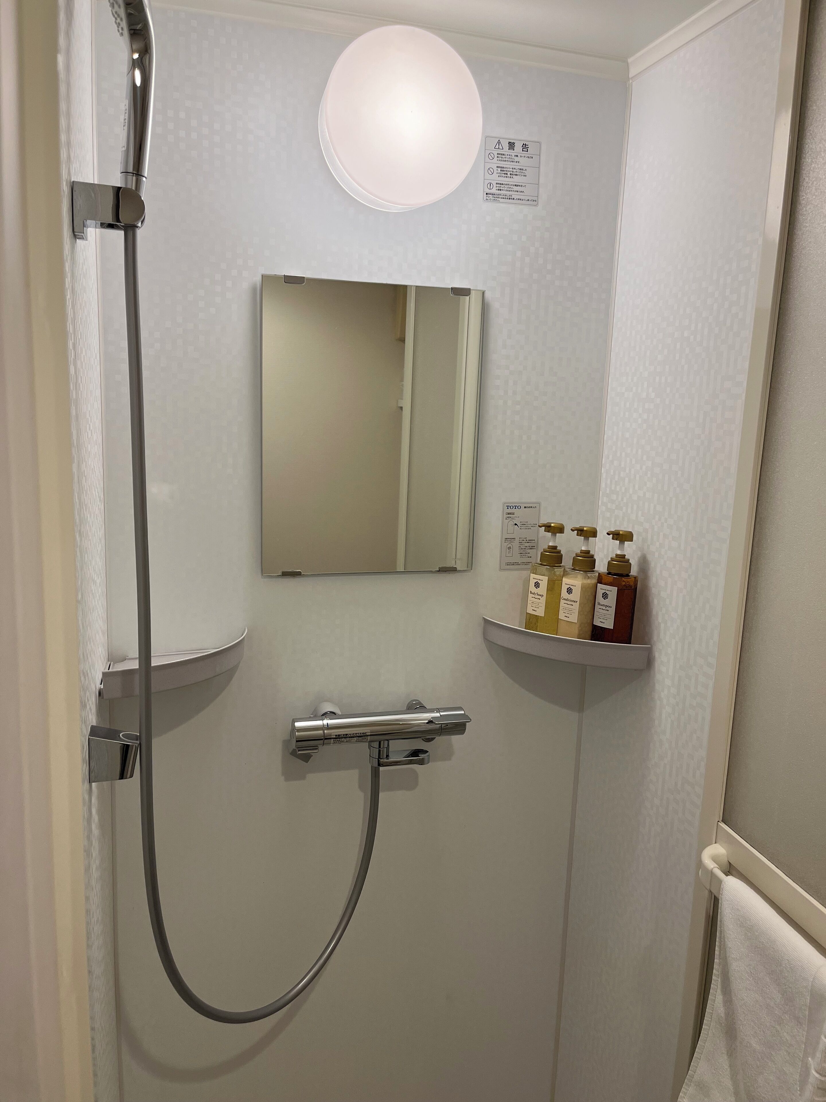 hair dryer, slippers, electronic bidet, towels