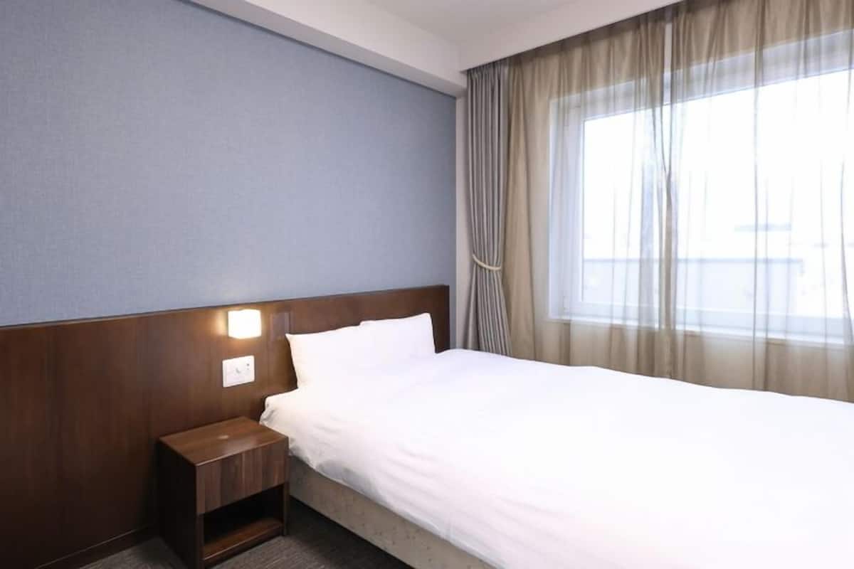 Premium bedding, down comforters, blackout drapes, WiFi (free)