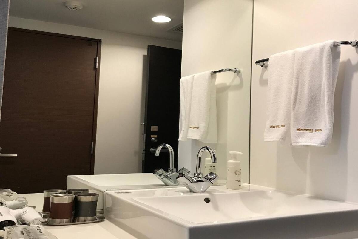 shower, hair dryer, bathrobes, slippers