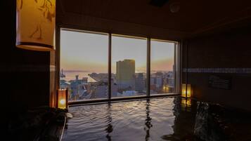 Relax by the serene pool with a city view.