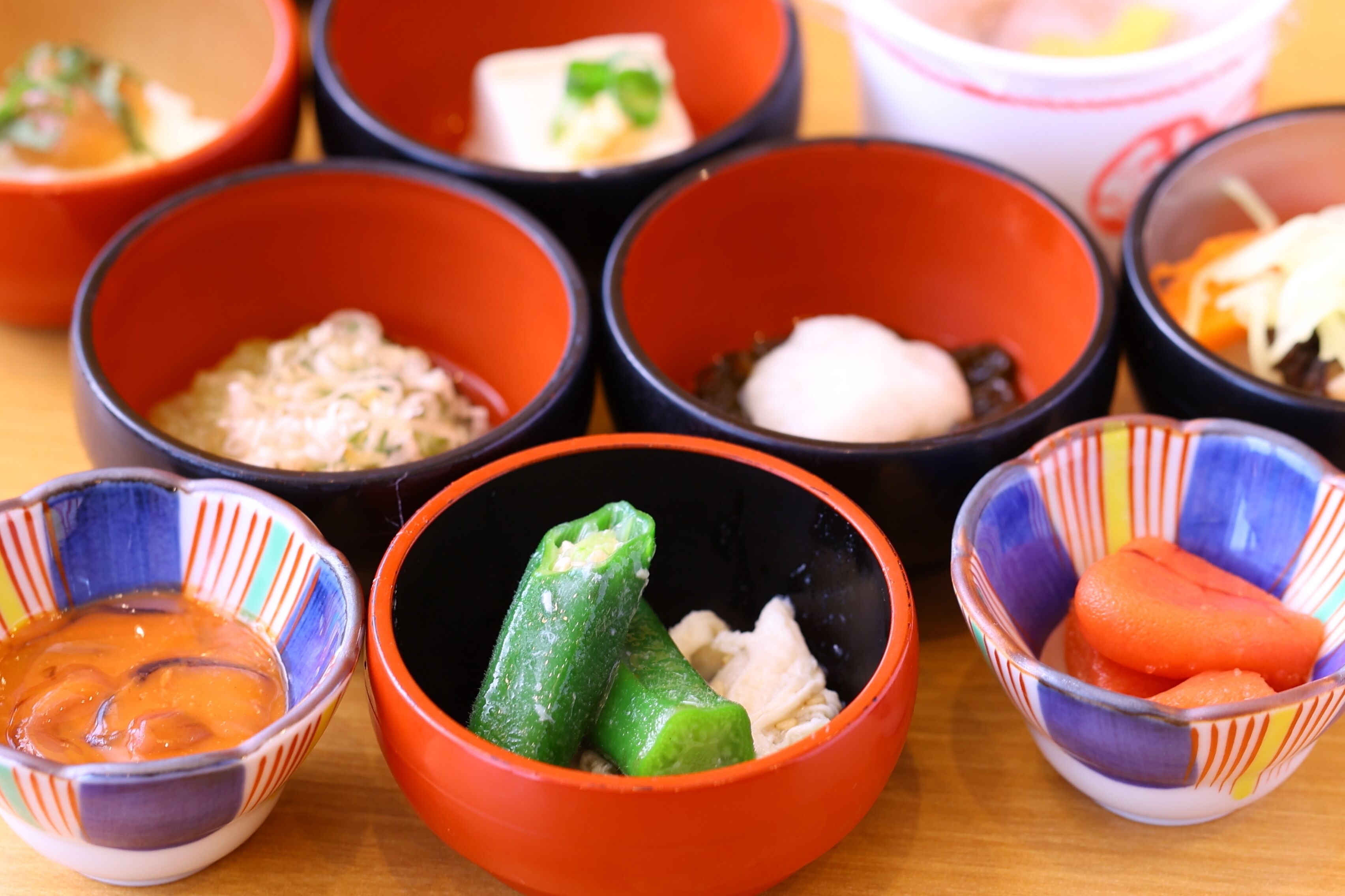 A variety of bowls containing different food items, likely part of a meal or snack selection.